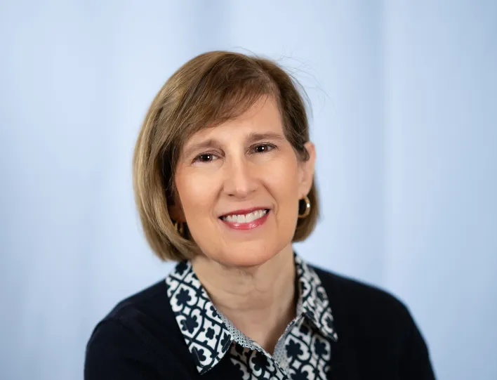 Eileen Meyer Author Headshot 3 Blue Bkgrd.jpg